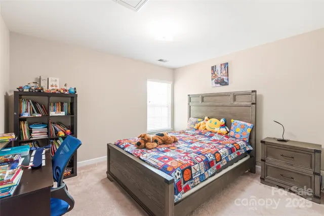 a bedroom with a bed and furniture