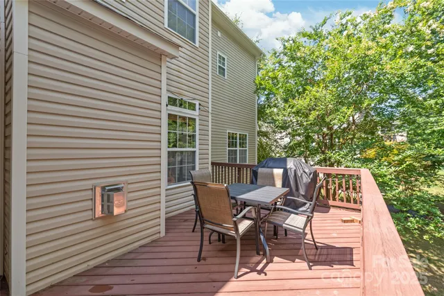 a view of backyard with a patio