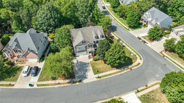 an aerial view of house with yard