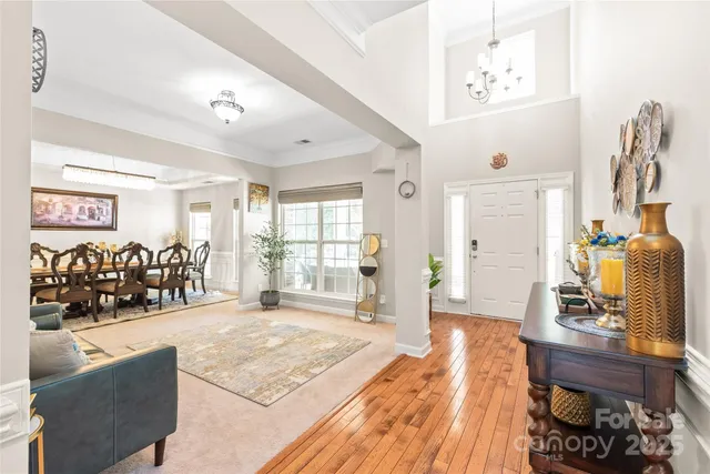 a living room with furniture window and wooden floor