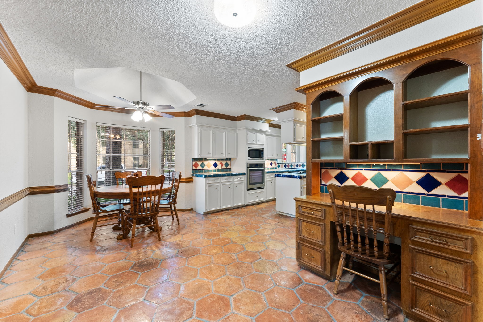 5718 Glenmere Lane Spring, TX 77379 - Photo 14 of 43 a view of a dining area with furniture and a kitchen