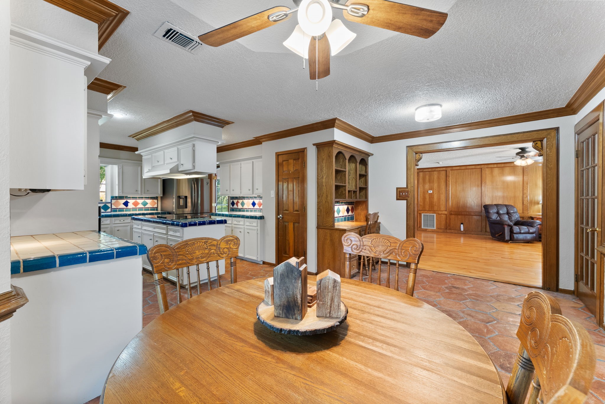 5718 Glenmere Lane Spring, TX 77379 - Photo 15 of 43 a living room with stainless steel appliances kitchen island granite countertop furniture a rug and a view of kitchen