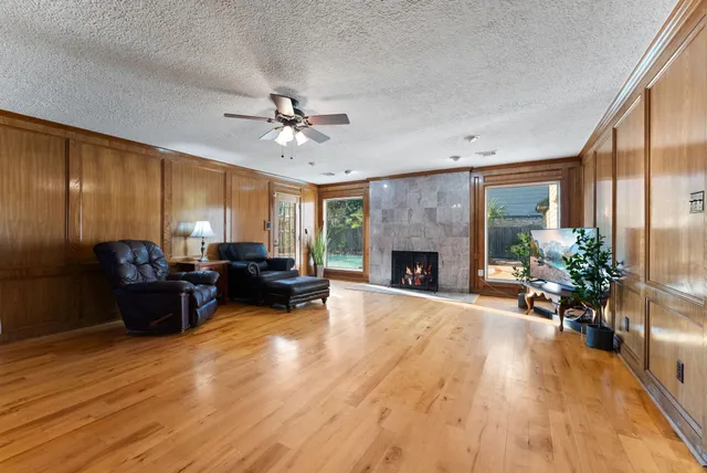 a living room with furniture and a fireplace