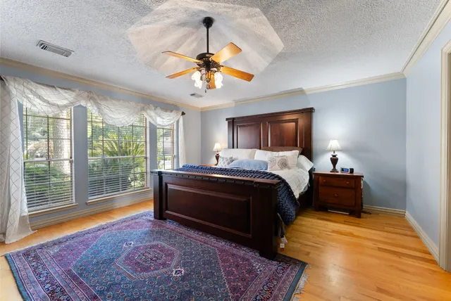 a bed room with a bed and a chandelier