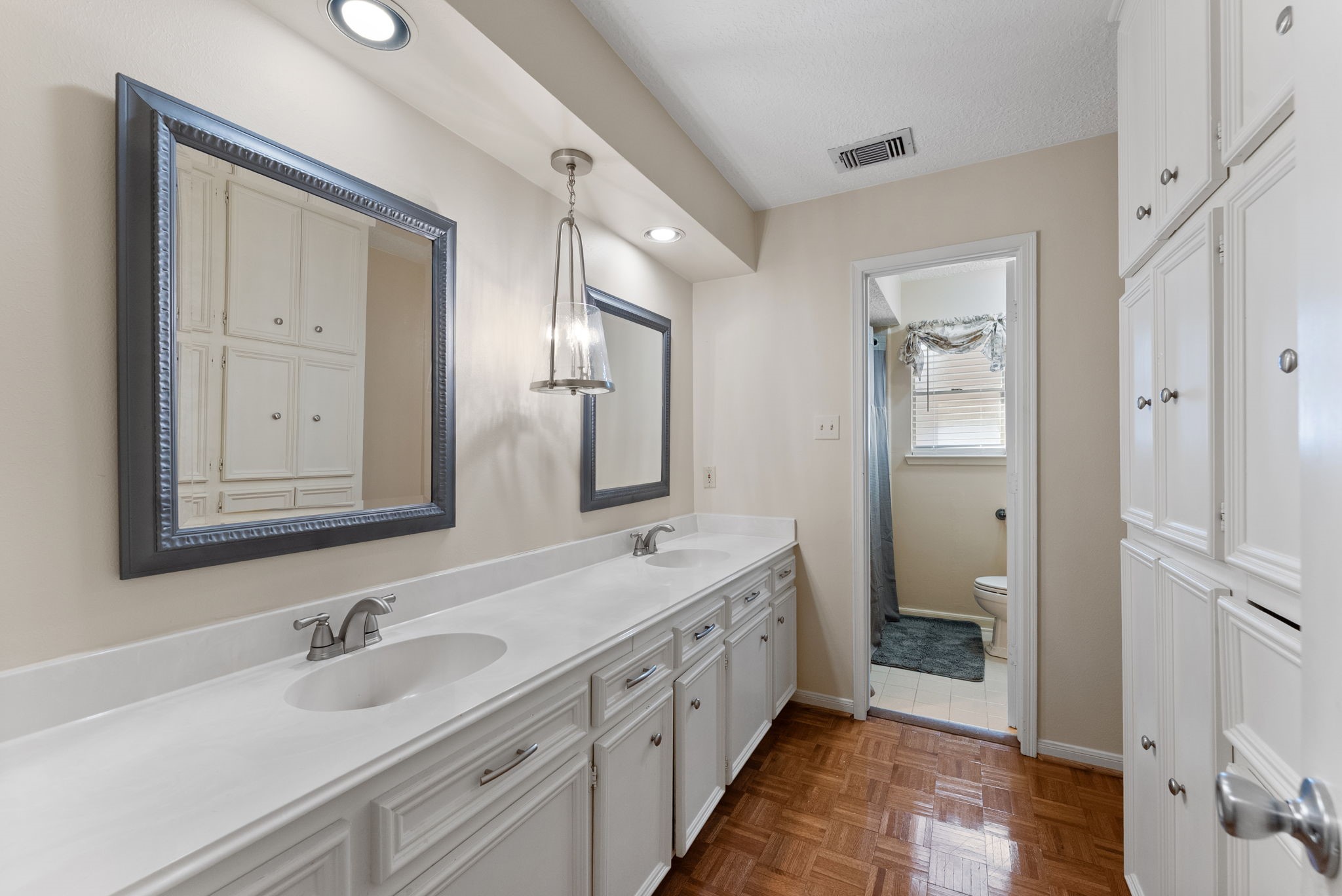 5718 Glenmere Lane Spring, TX 77379 - Photo 30 of 43 a bathroom with double vanity sinks and a mirror
