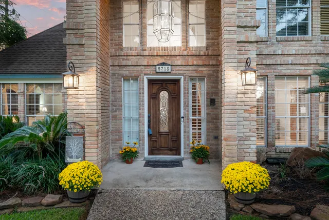 a front view of a house with outdoor seating