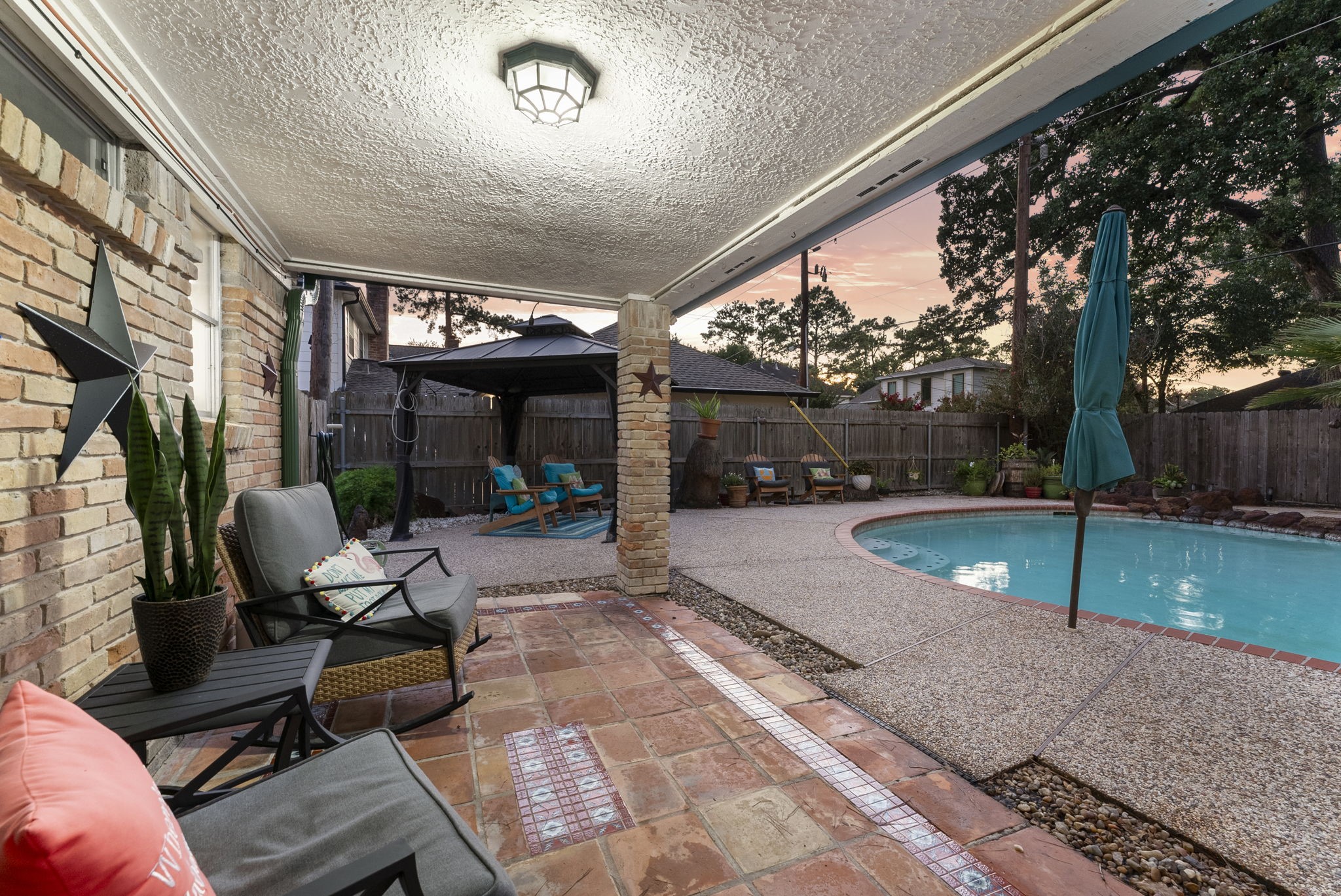 5718 Glenmere Lane Spring, TX 77379 - Photo 35 of 43 a view of a patio with chairs and a large tree