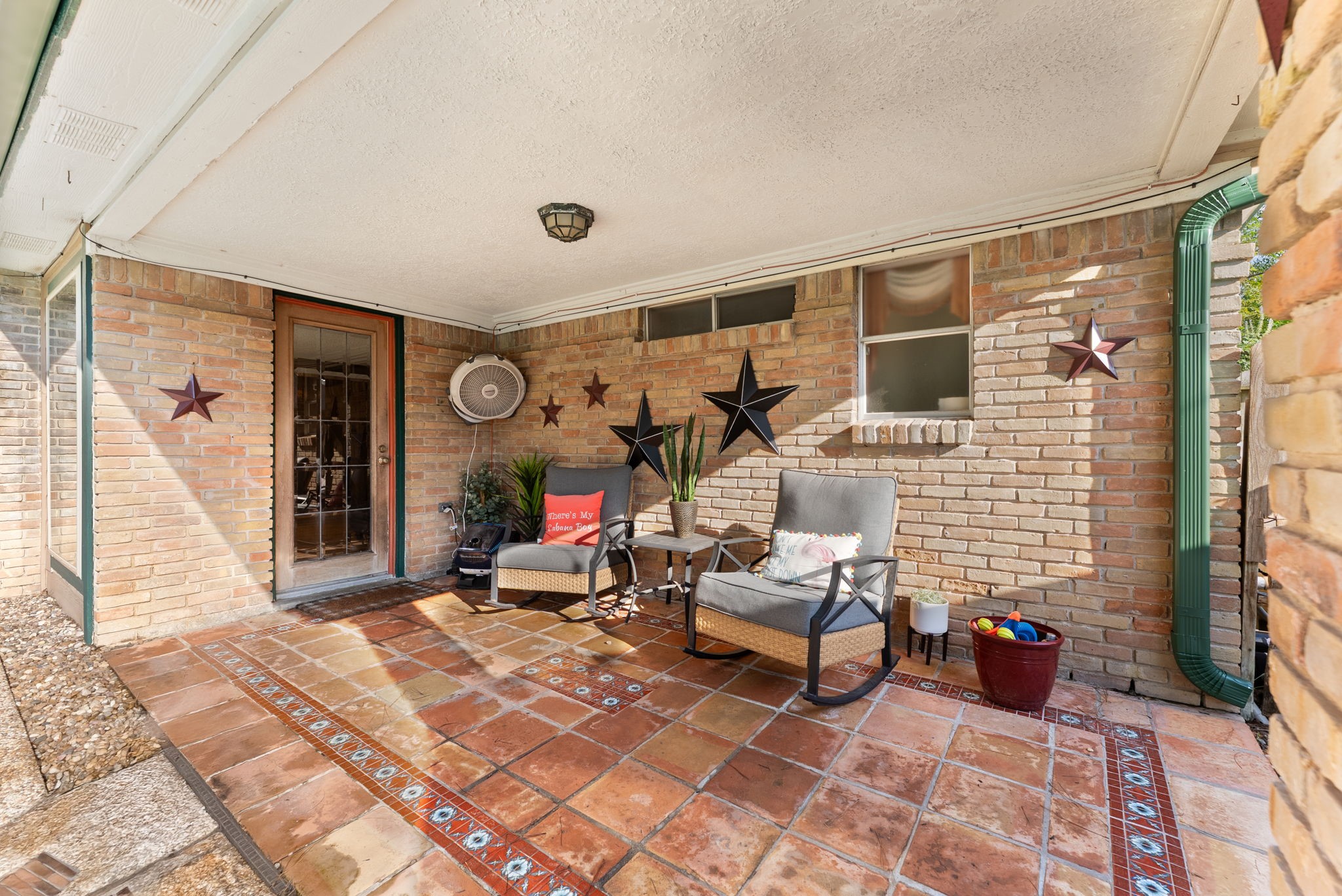 5718 Glenmere Lane Spring, TX 77379 - Photo 36 of 43 a building outdoor space with patio furniture and potted plants