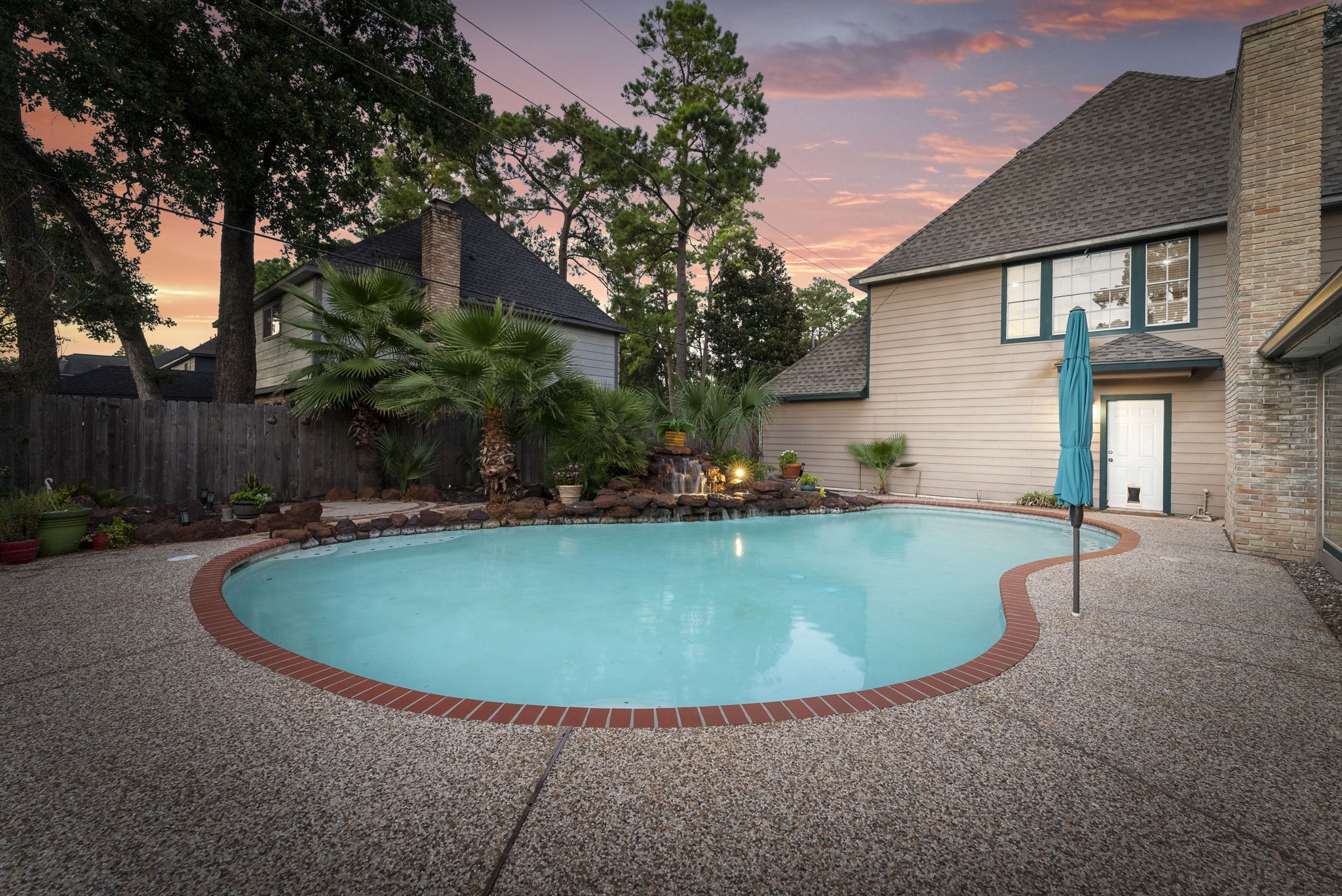 5718 Glenmere Lane Spring, TX 77379 - Photo 37 of 43 a view of a house with swimming pool