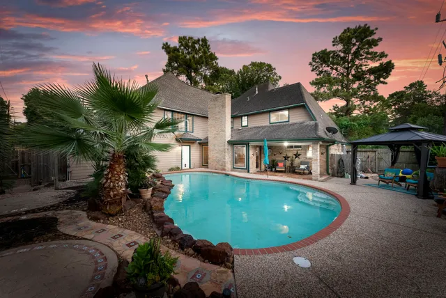 a view of a swimming pool with a patio