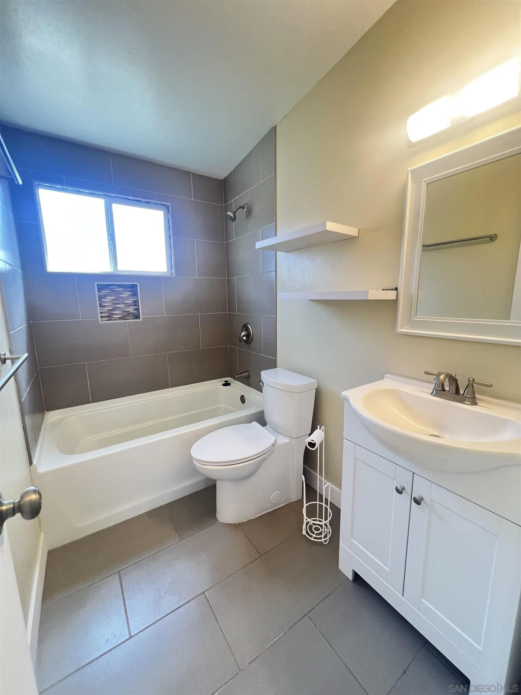 9267 Fairlawn Street Santee, CA 92071 - Photo 6 of 12 a bathroom with a sink a toilet and a bathtub