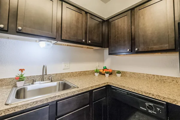 a kitchen with a sink and cabinets
