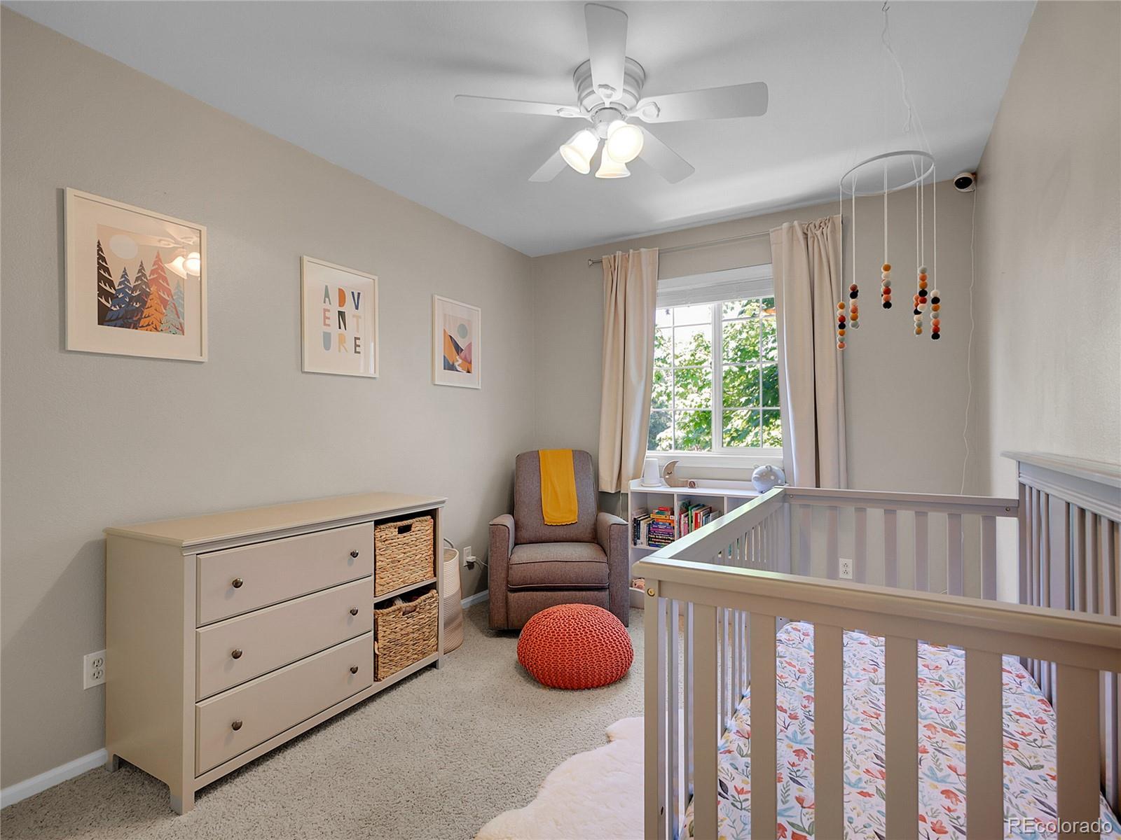 1234 Riddlewood Lane Highlands Ranch, CO 80129 - Photo 16 of 25 a bedroom with a bed and window