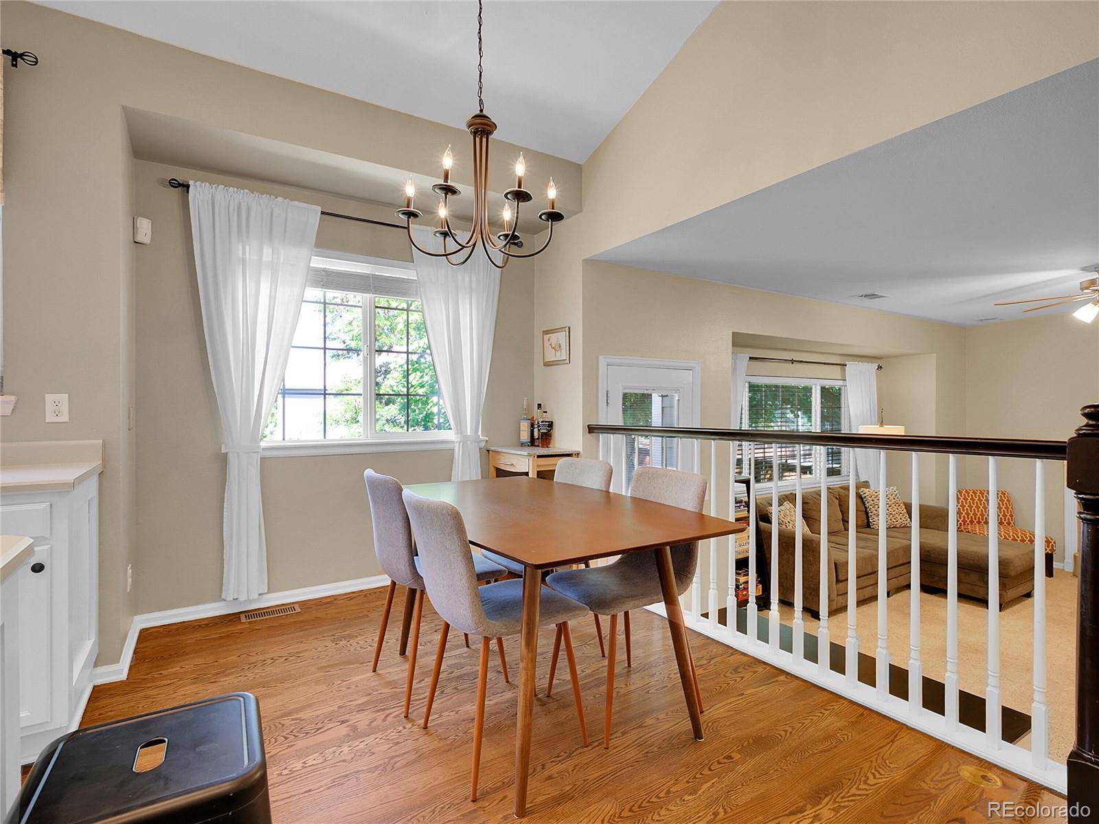 1234 Riddlewood Lane Highlands Ranch, CO 80129 - Photo 6 of 25 a view of a dining room with furniture window and wooden floor