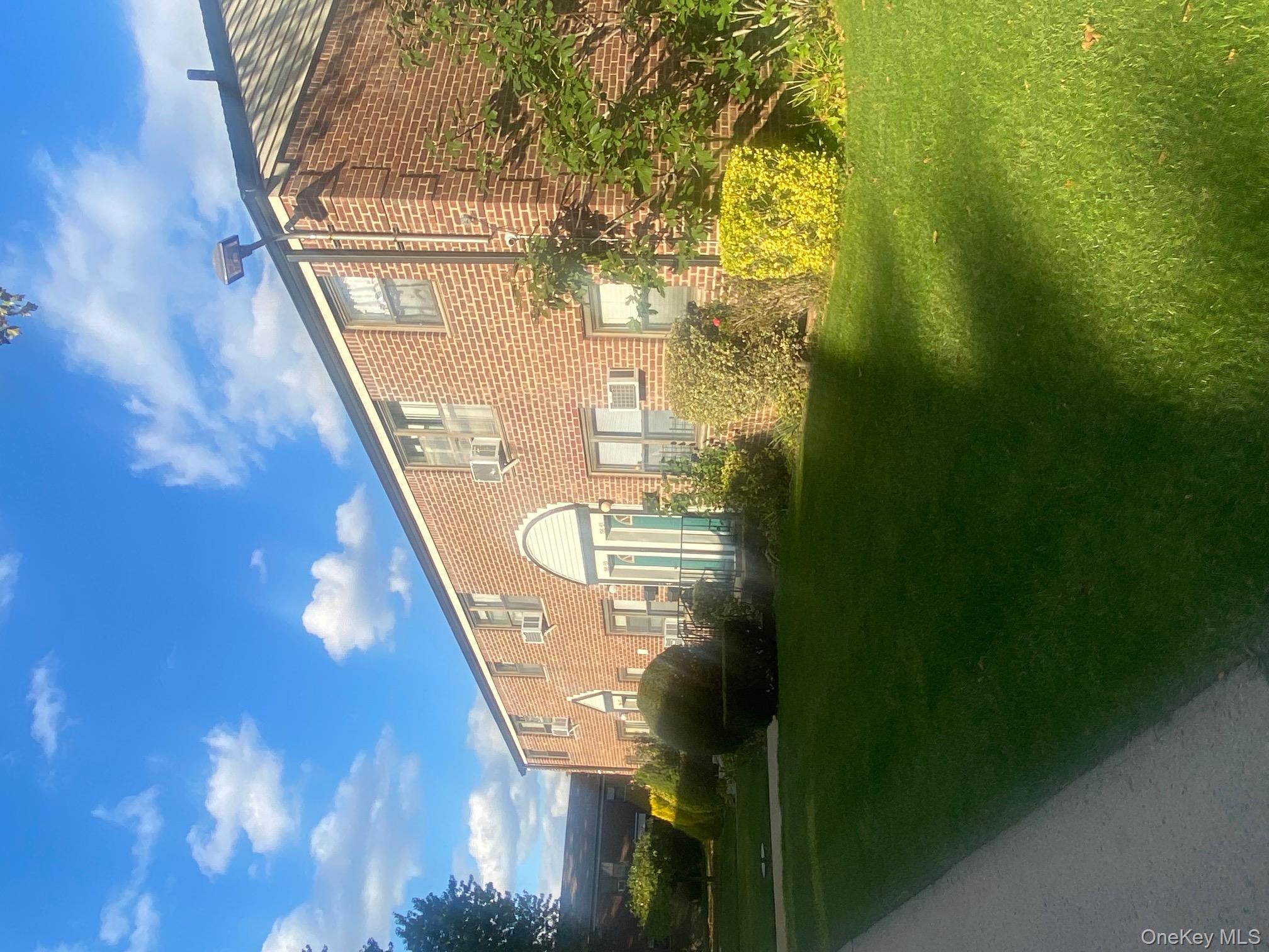 196-61 69th Avenue, Unit 1 Queens, NY 11365 - Photo 12 of 13 a view of a back yard of the house