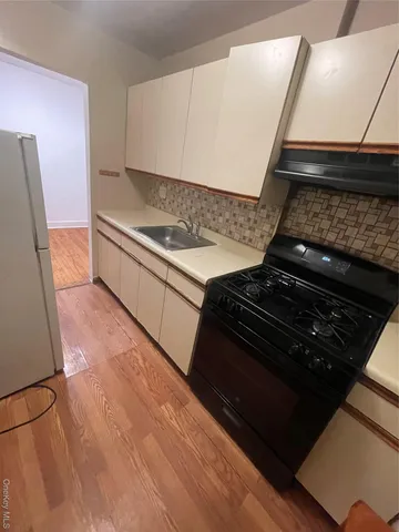 a view of a kitchen with a sink and dishwasher
