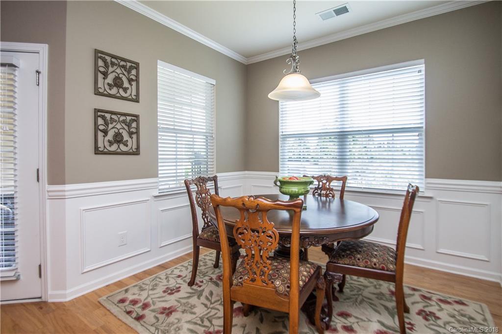 4016 Perth Road Indian Land, SC 29707 - Photo 12 of 28 a view of a dining room with furniture window and wooden floor