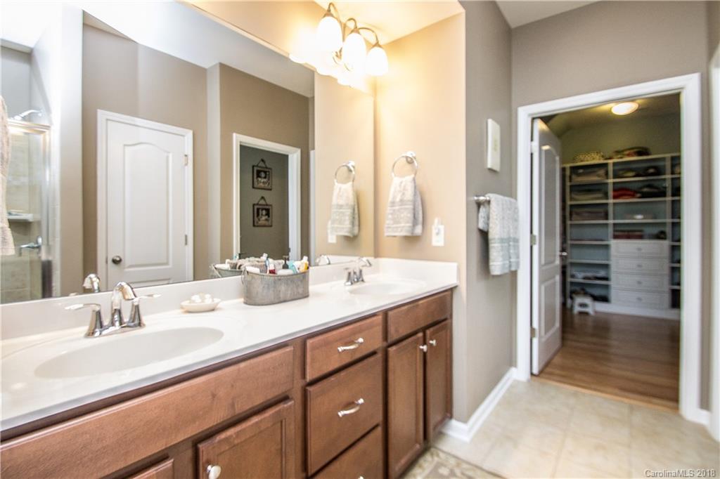 4016 Perth Road Indian Land, SC 29707 - Photo 14 of 28 a bathroom with a double vanity sink a and mirror
