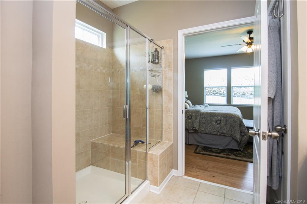 4016 Perth Road Indian Land, SC 29707 - Photo 17 of 28 a en suite bathroom with a glass shower door and a window
