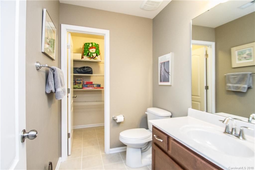 4016 Perth Road Indian Land, SC 29707 - Photo 25 of 28 a bathroom with a granite countertop sink toilet and shower