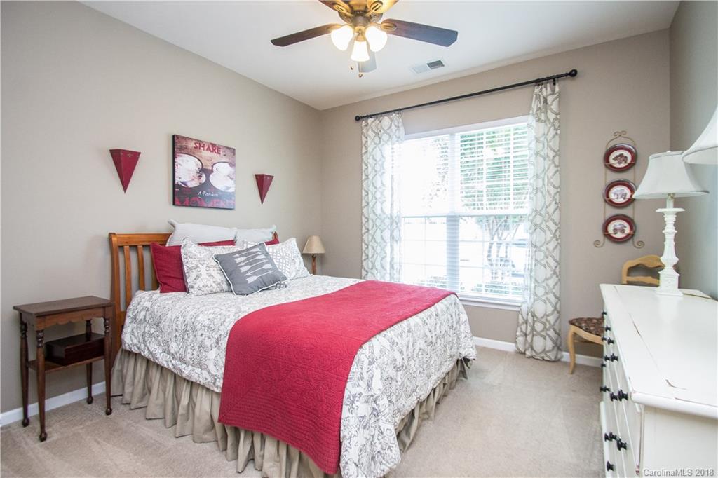 4016 Perth Road Indian Land, SC 29707 - Photo 4 of 28 a bedroom with a bed and a chandelier