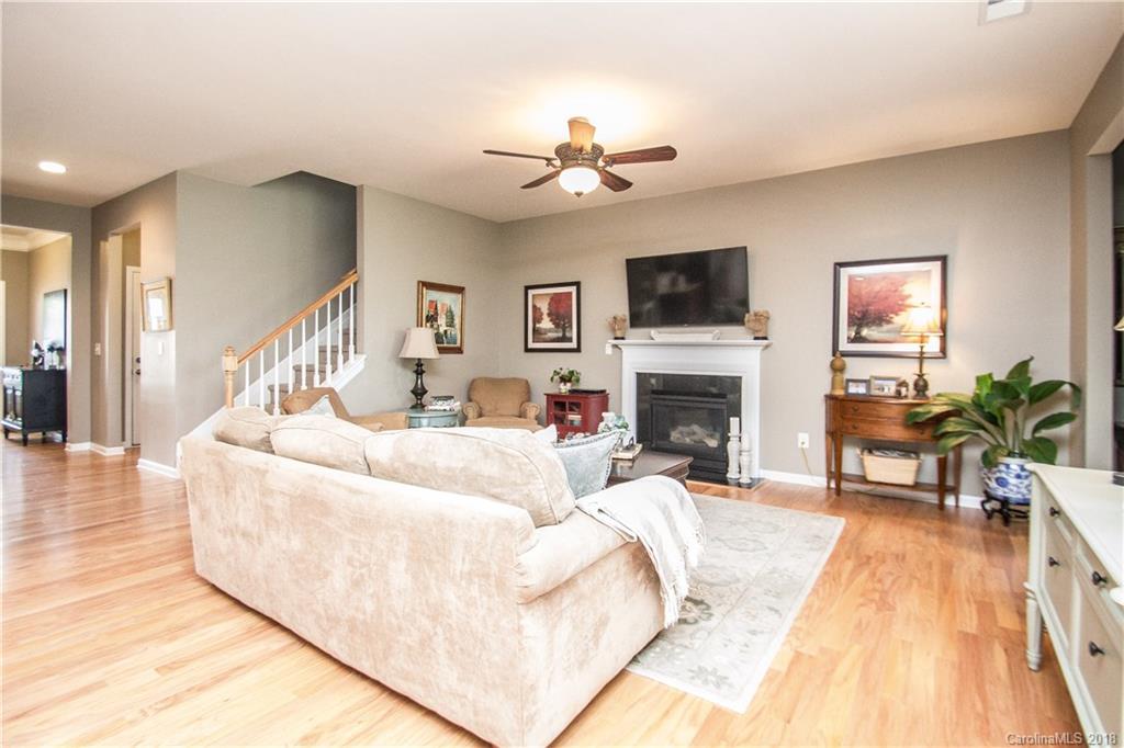 4016 Perth Road Indian Land, SC 29707 - Photo 9 of 28 a living room with furniture a flat screen tv and a fireplace