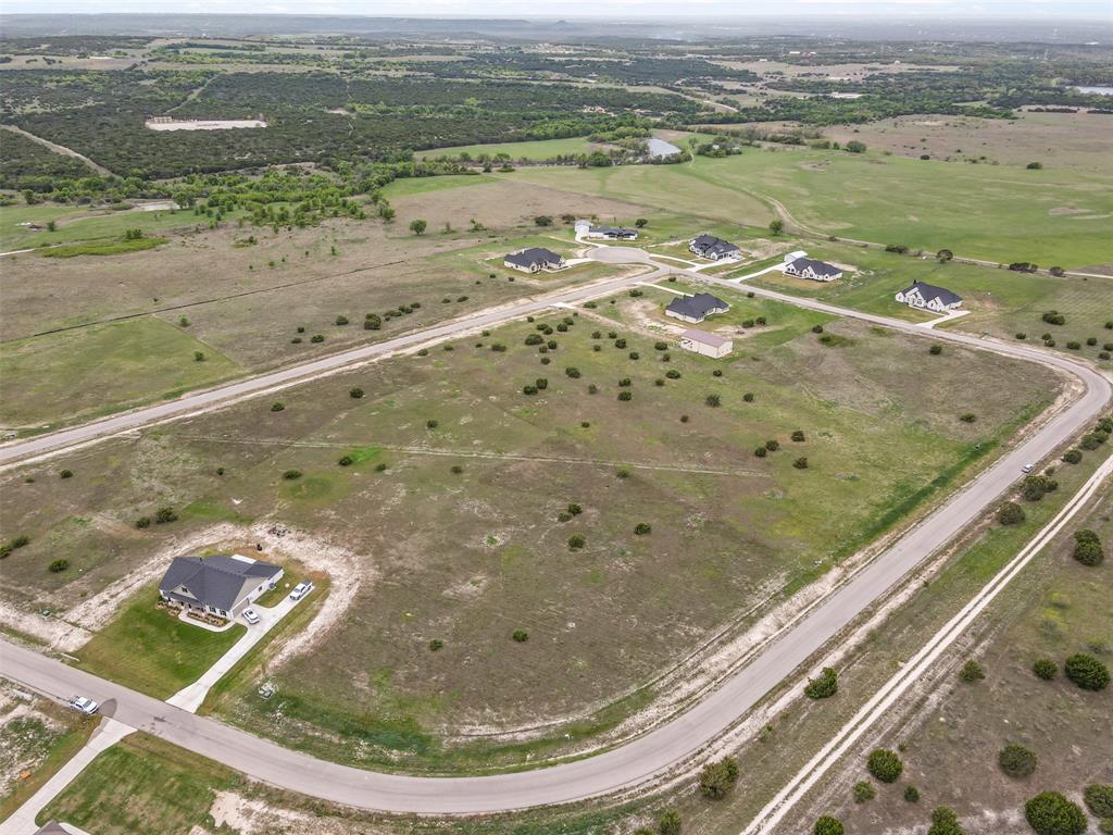 12833 Torello Court Godley, TX 76044 - Photo 7 of 14 a view of a lake with a mountain