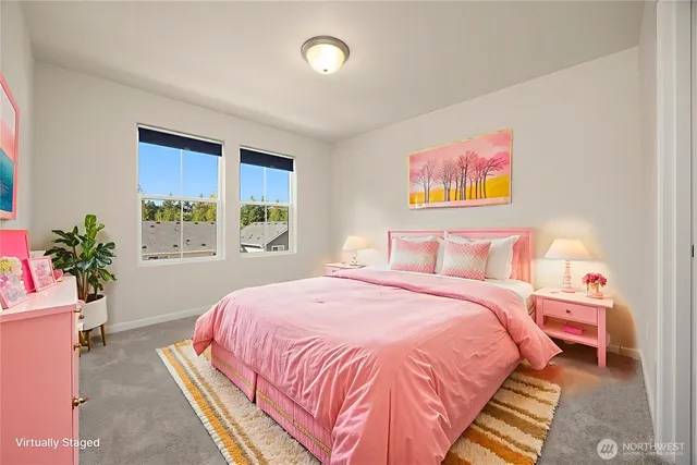 a bedroom with bed and a potted plant