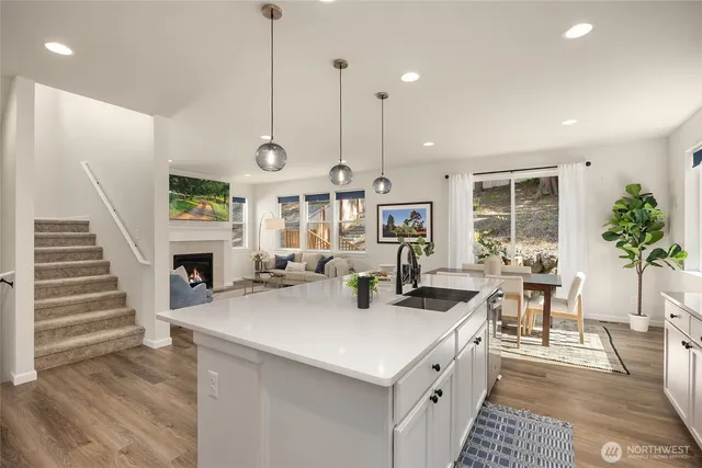 a kitchen with sink a counter and cabinets