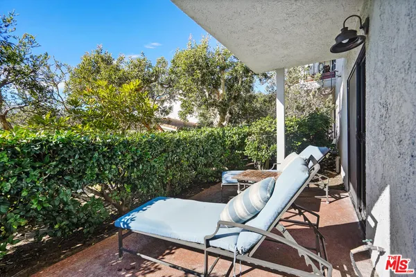 a view of a balcony with chairs