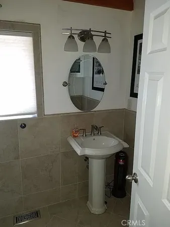 a bathroom with a sink and mirror