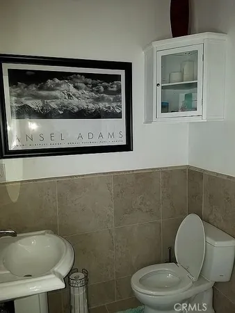 a bathroom with a toilet and a sink