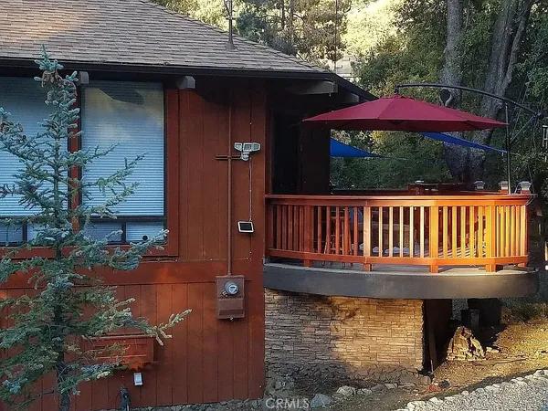 a balcony with table and chairs