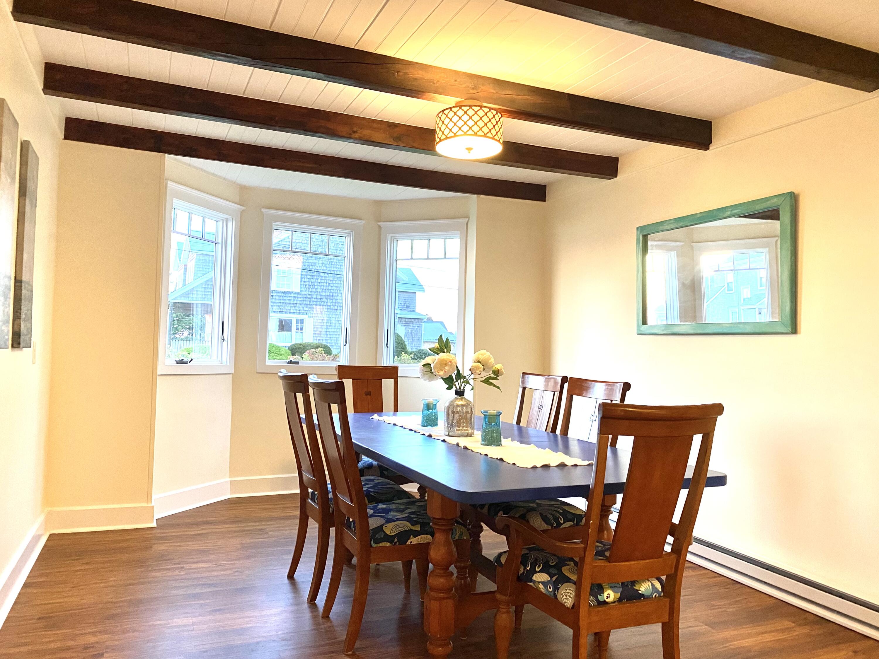 32 Shore Road West Yarmouth, MA 02673 - Photo 11 of 23 a view of a dining room with furniture and wooden floor