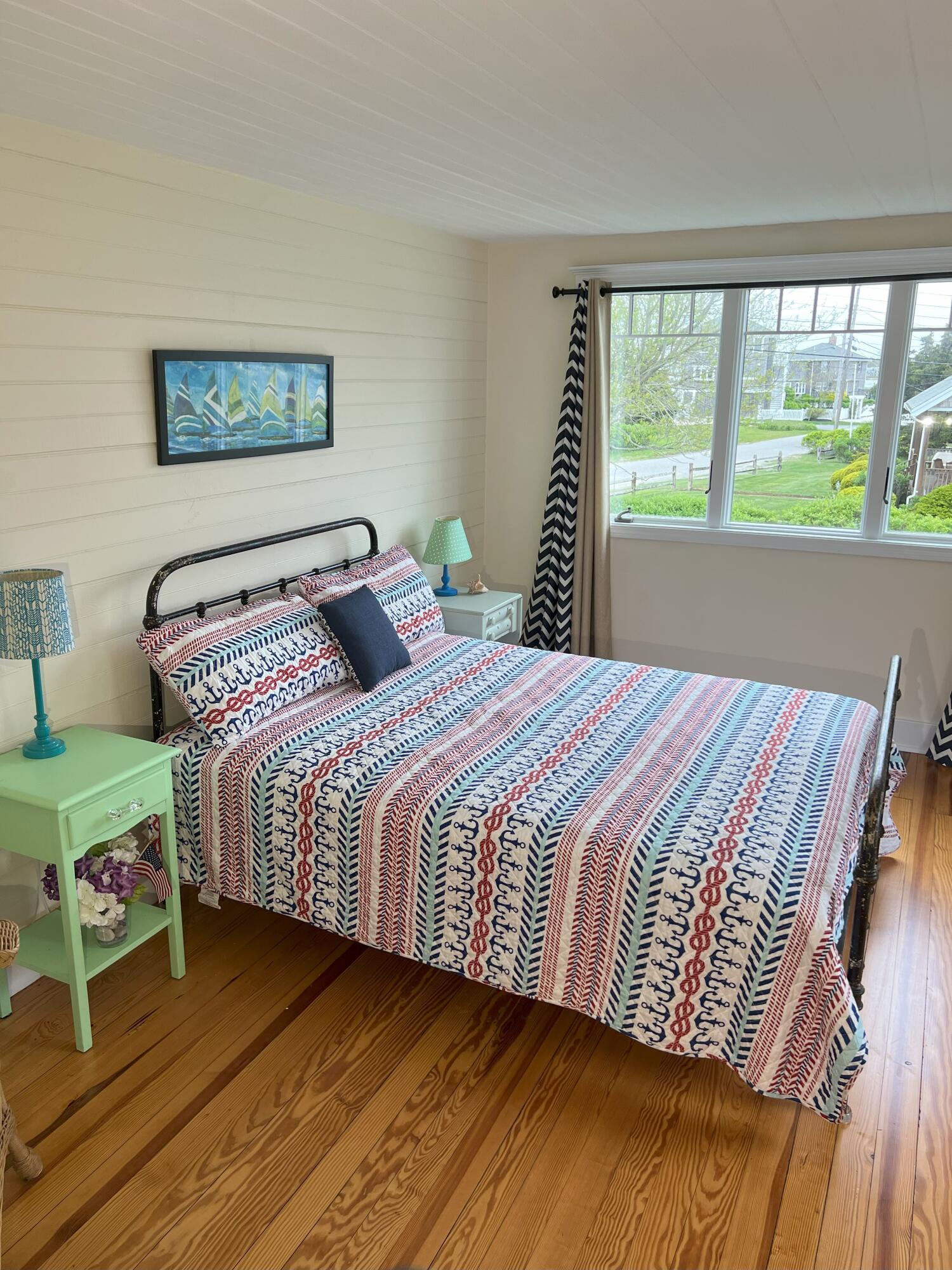 32 Shore Road West Yarmouth, MA 02673 - Photo 15 of 23 a bedroom with a large bed and a window