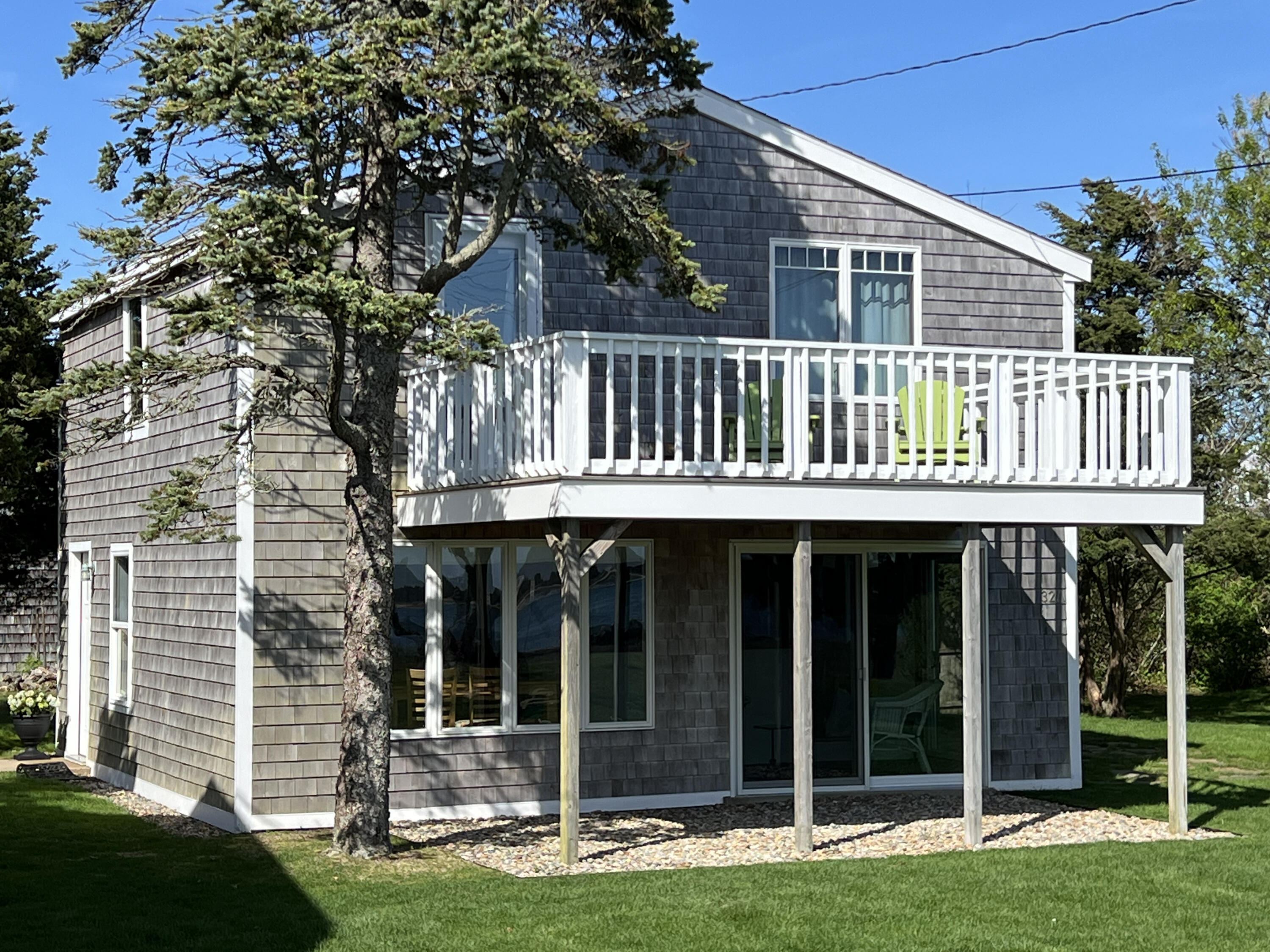 32 Shore Road West Yarmouth, MA 02673 - Photo 16 of 23 a front view of a house with a yard