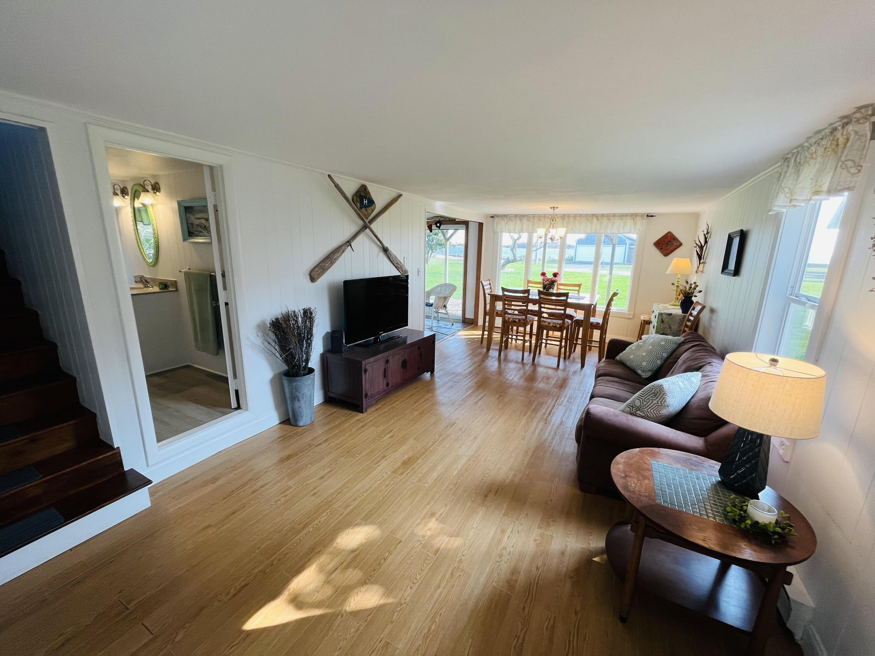 32 Shore Road West Yarmouth, MA 02673 - Photo 18 of 23 a living room with furniture and a flat screen tv