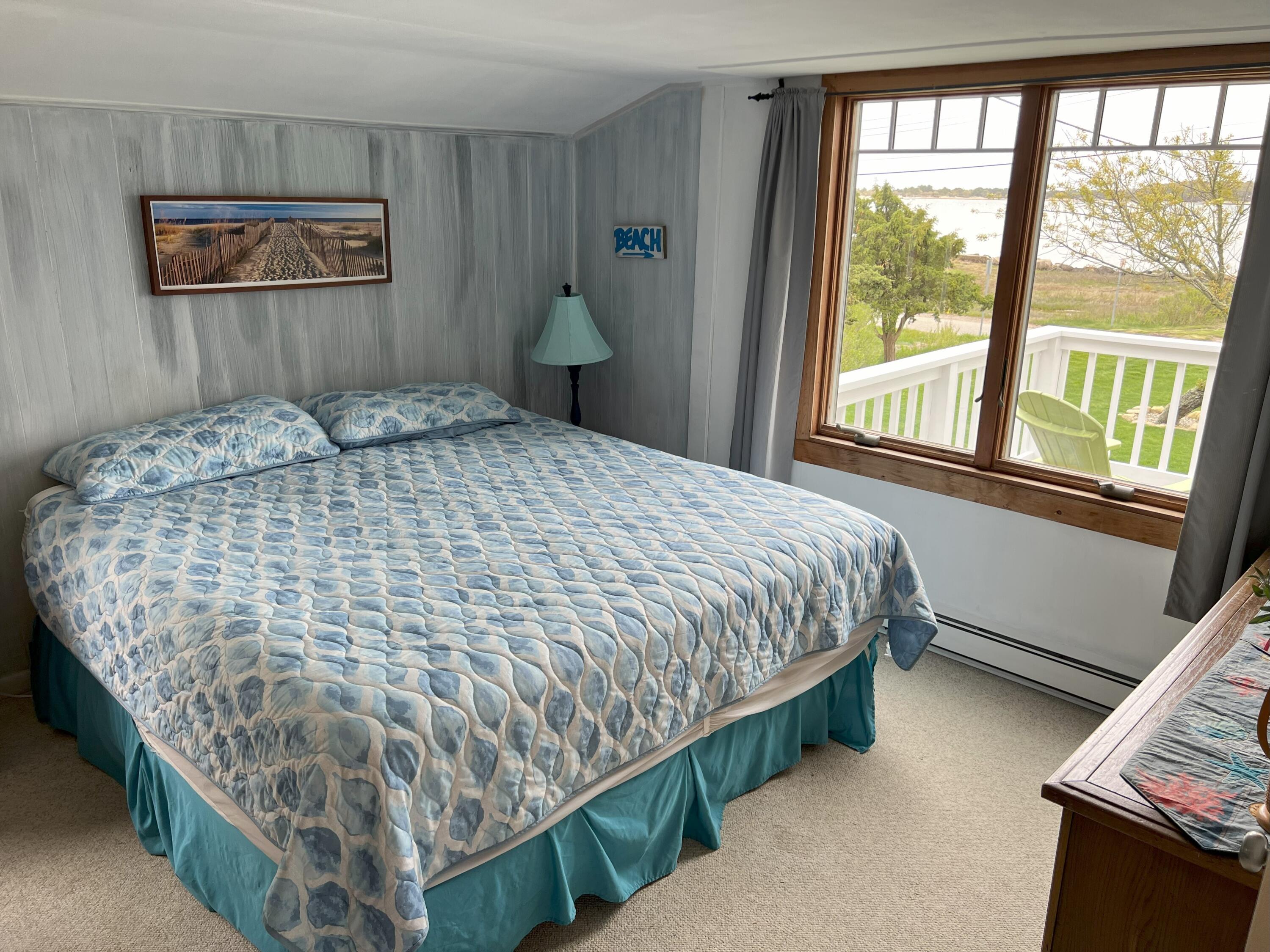 32 Shore Road West Yarmouth, MA 02673 - Photo 19 of 23 a bedroom with a bed and a window