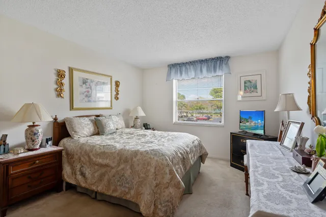 a bedroom with a bed and furniture