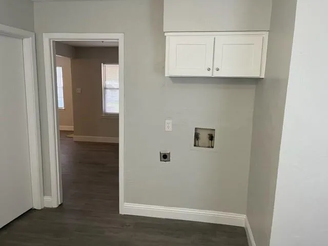 a view of kitchen with white cabinets