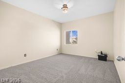 7701 West Robindale Road, Unit 277 Las Vegas, NV 89113 - Photo 19 of 33 A well-lit bedroom features plush carpeting and a warm, inviting ambiance.