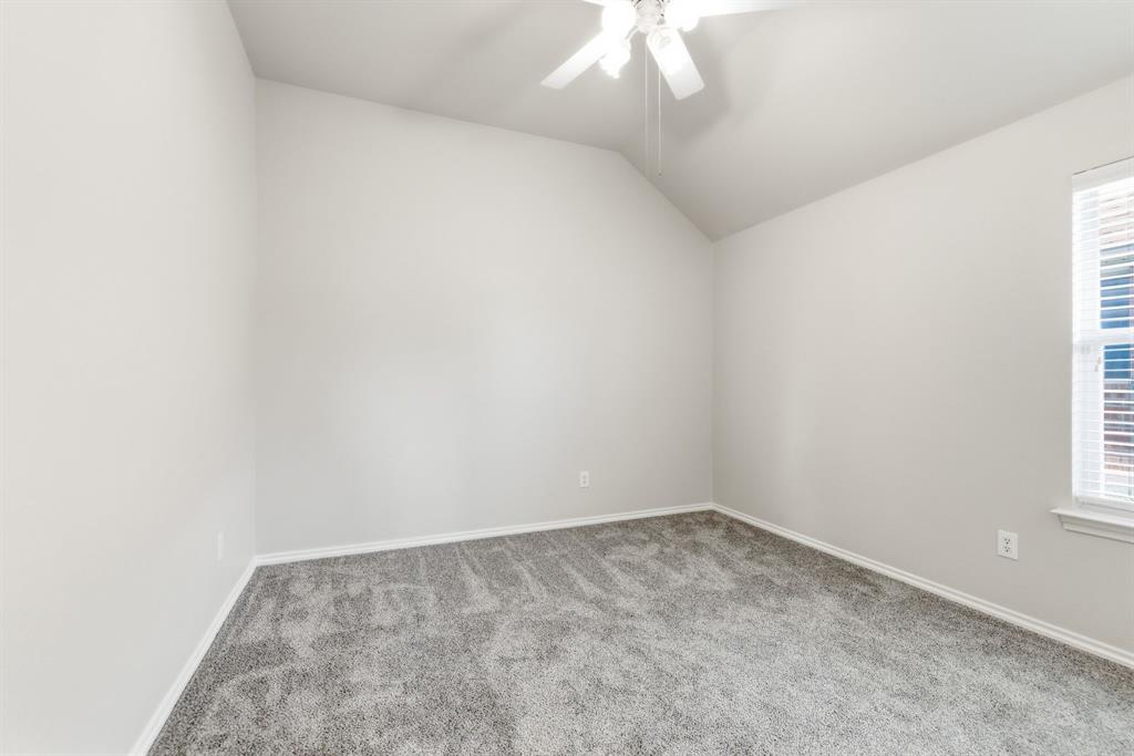 817 Huebner Way Burleson, TX 76028 - Photo 22 of 35 This bedroom has new carpet, vaulted ceiling and ceiling fan.