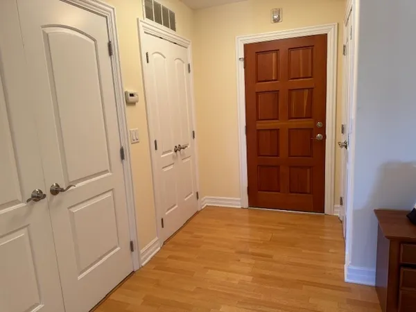 a kitchen with granite countertop wooden cabinets and a stove top oven