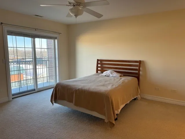 a bathroom with a granite countertop sink a large mirror and a bathtub
