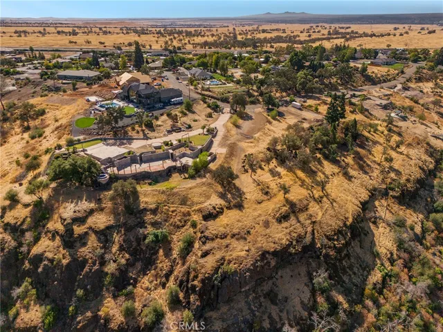 an aerial view of residential houses with city view