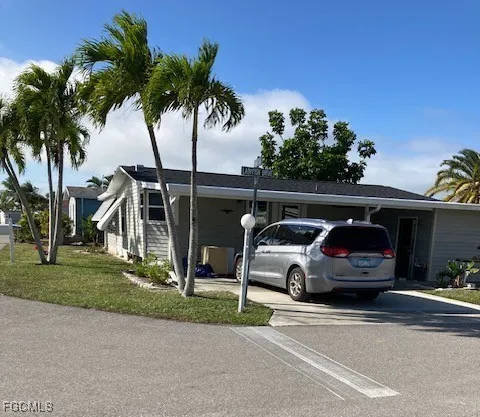 a view of street and car parked on the side of the road