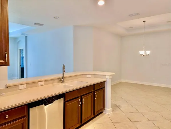 a bathroom with a sink and a refrigerator
