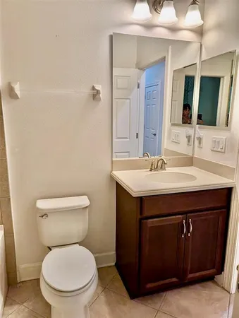 a bathroom with a sink a toilet and a bathtub
