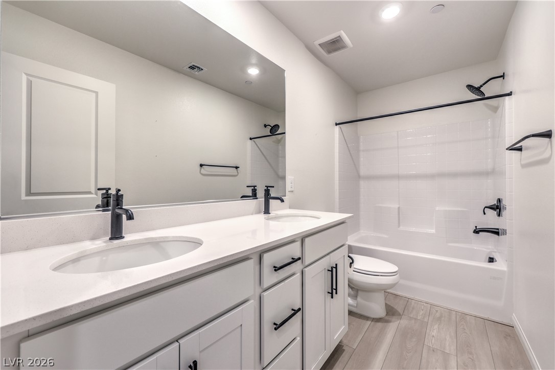 3782 Alla Rocca Avenue Henderson, NV 89044 - Photo 37 of 55 This bright bathroom features a dual vanity and a clean bathtub.