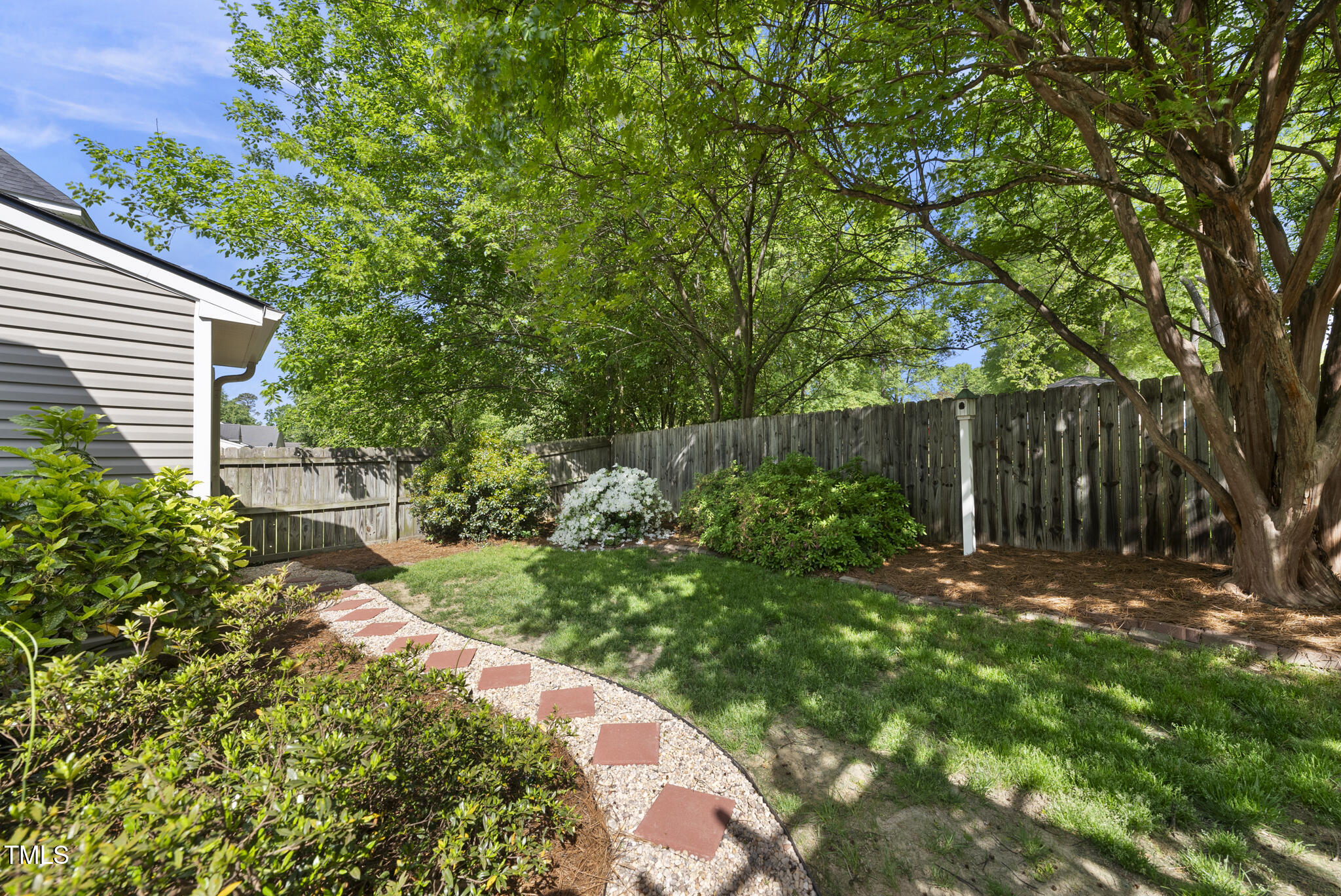 3519 Streams Of Fields Drive Raleigh, NC 27604 - Photo 17 of 20 a backyard of a house with lots of green space